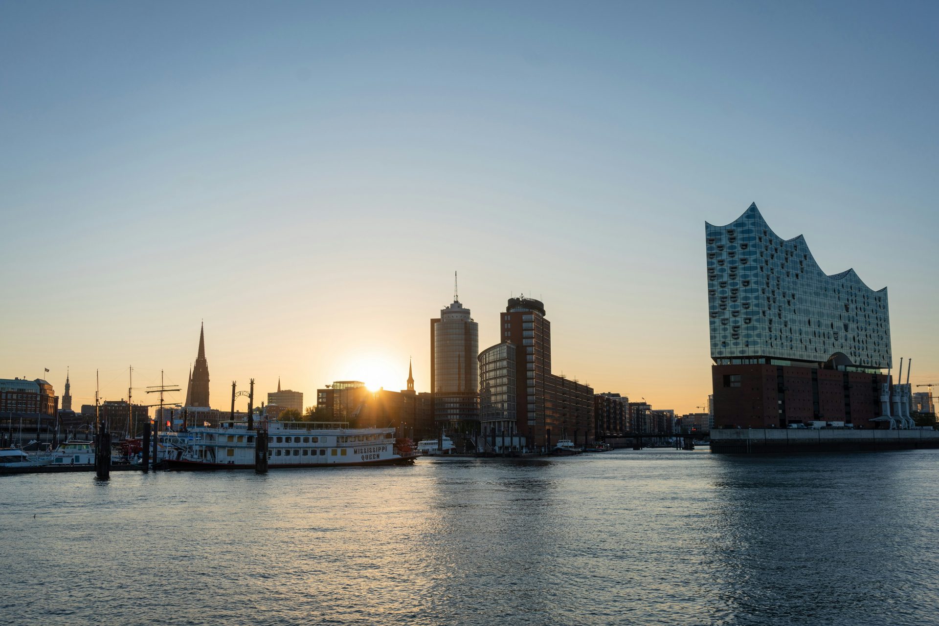 city skyline across body of water during daytime